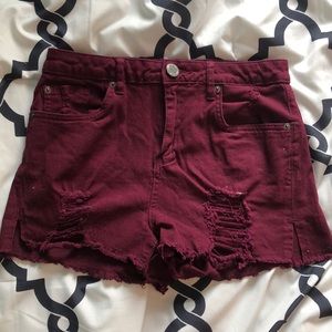Maroon ripped jean shorts